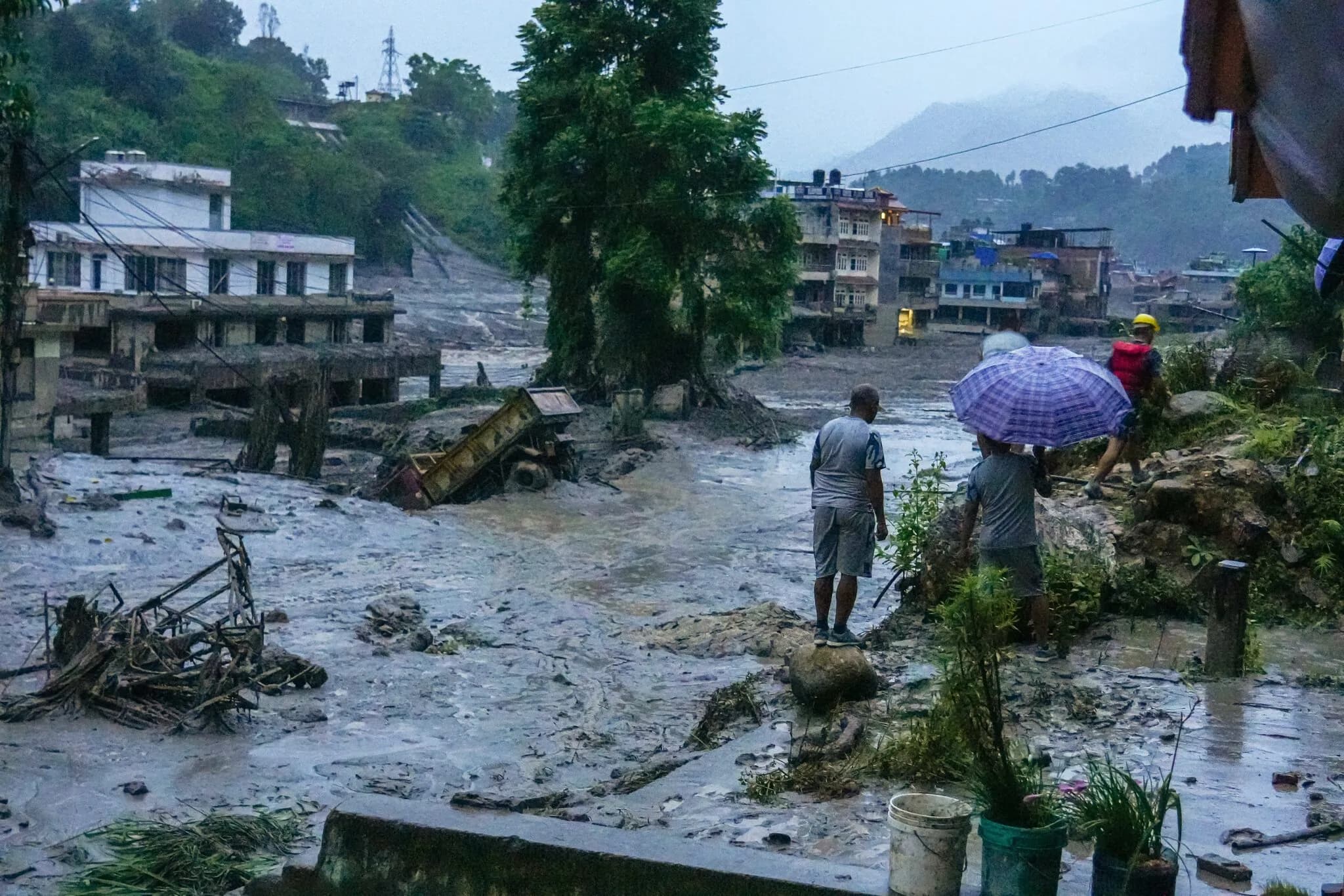 Aerial view of a Nepali village submerged by a mud and debris flow